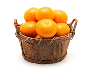 Mandarin in basket isolated on white