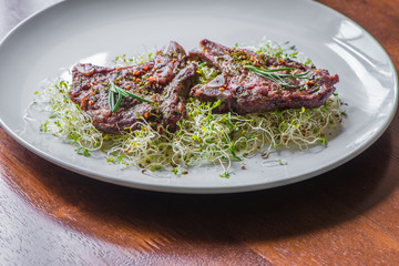 Rack of Lamb with Alfalfa seedlings