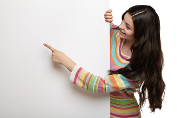 Happy smiling young woman showing blank signboard.