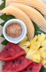 Colorful Thai fresh fruit in season with chili powder dip