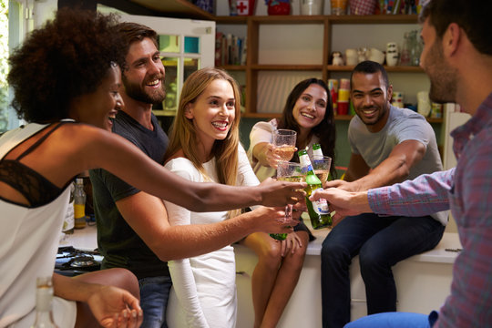 Group Of Friends Enjoying Drinks Party At Home