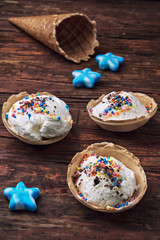 Obraz na płótnie Canvas ice cream decorated with sweet powder in the wafer