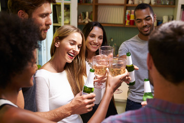 Group Of Friends Enjoying Drinks Party At Home