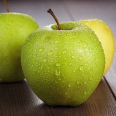 fresh green apples on the table