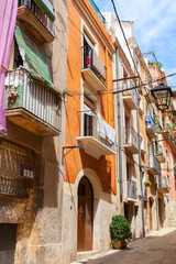 Fototapeta premium Narrow empty street of Tarragona city, Spain