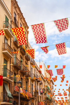 Flags Of Tarragona City And Catalonia Hanging Over Street