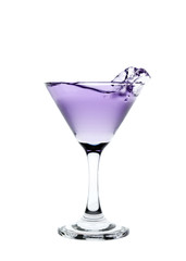 Purple liquid splashing in a martini glass isolated on white bac