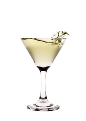Yellow liquid splashing in a martini glass isolated on white bac