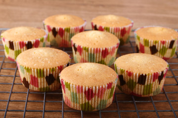 Freshly baked muffins served on cooling rack