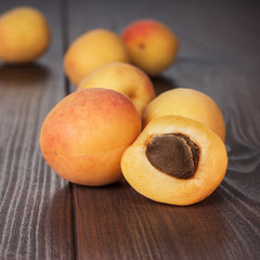 Naklejka na ściany i meble some fresh apricots over wooden background