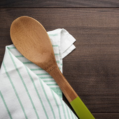 wooden spoon on the brown table