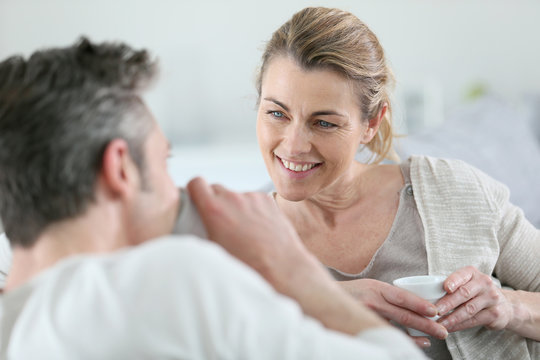 Mature Couple Talking Together In Sofa