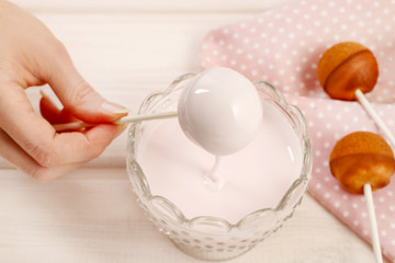 Woman making cake pops.