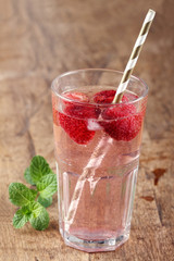 strawberry drinks on wood background