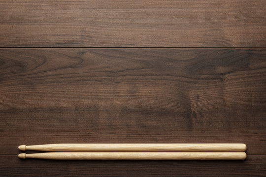 wooden drumsticks on wooden table