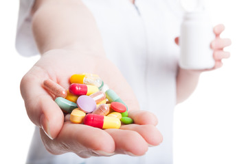 Close up with woman hand holding pills