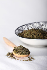 Green tea on wooden spoon