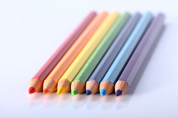 Colored pencils isolated on white background close up