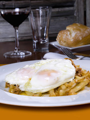 Dish of fried eggs on a potato chip