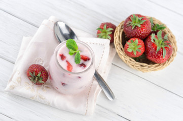 Strawberry yogurt  with fresh fruits and mint leaves