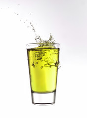 Splash in a glass of yellow lemonade