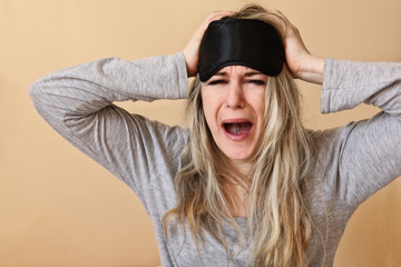 Young women screaming,with sleeping mask