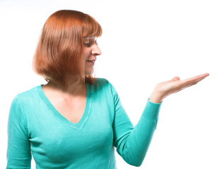 beautiful red-haired girl holding something on her hand