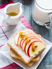 toast with cheese, apple and dried fruits, healthy breakfast