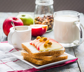 bran toast with cheese, apple and dried fruits, healthy breakfas