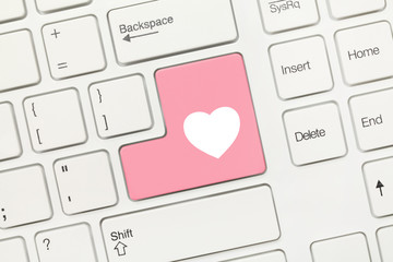 White conceptual keyboard - Pink key with heart symbol