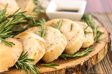 fresh baked resomary bread loaf and olive oil and balsamic vineg