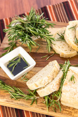 fresh baked rosemary bread loaf and olive oil and balsamic vineg