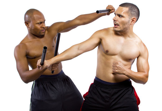 two martial artists sparring with Kali Escrima or Arnis
