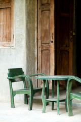 Living area, wood green chair and wood door