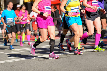 Fototapeta na wymiar Marathon running race, women runners feet on road, sport concept
