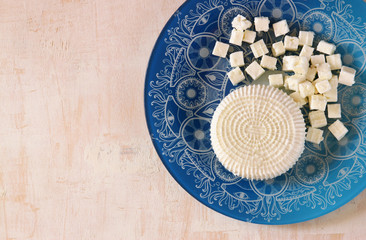 top view of greek cheese and bulgarian cheese on wooden table ov