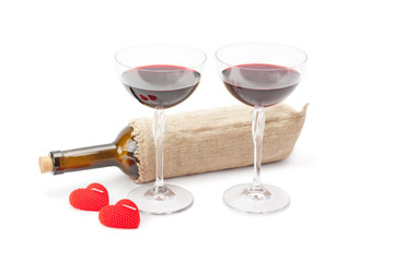 candles ,bottle of wine and glasses with red wine
