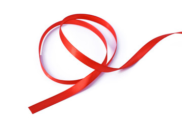 Shiny colorful red satin ribbon on white background