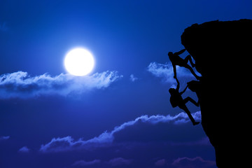 teamwork of two people man and girl travelers help on mountain