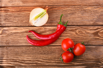 Juicy tomato cherry, white onion and red hot chili pepper