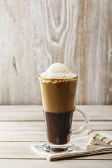 cold coffee with ice cream in a glass