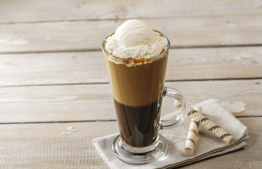 cold coffee with ice cream in a glass
