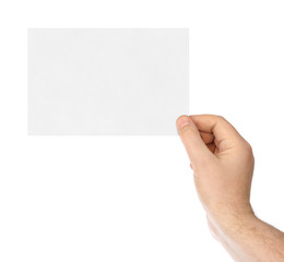 Fototapeta premium Blank paper card in hand