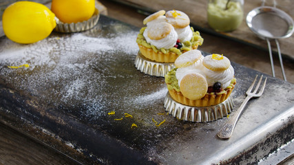 tartlets with cream, tea matcha curd and whisked egg whites