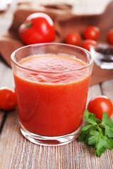 Glass of tomato juice with cherry tomatoes
