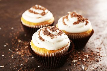 Delicious cupcakes on table close-up
