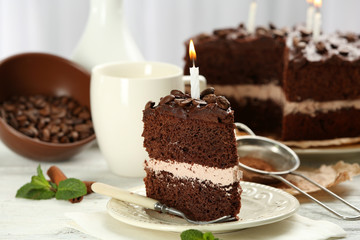 Delicious chocolate cake on table on light background