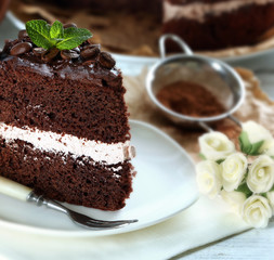 Delicious chocolate cake on table close-up