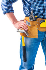 Fototapeta na wymiar carpenter holding hand on toolbelt with tools construction conce