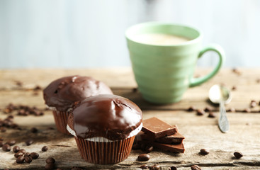 Tasty homemade chocolate muffins and cup of coffee